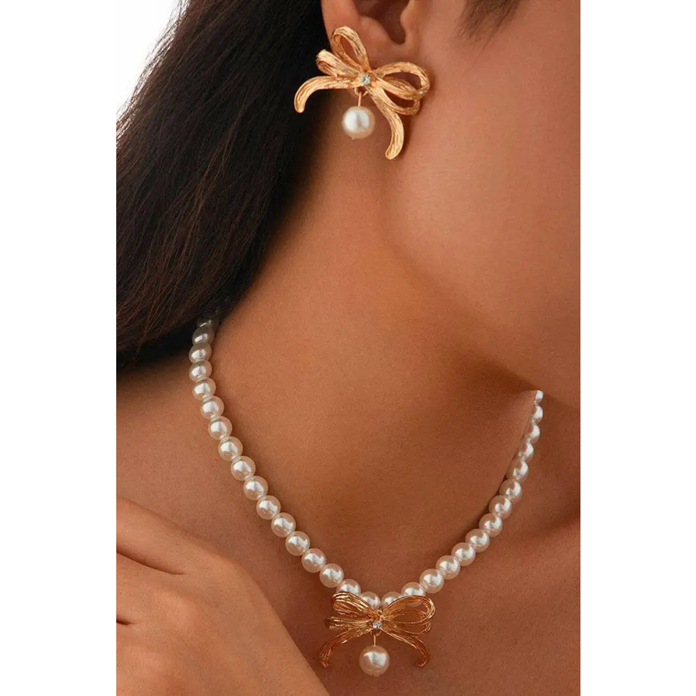 Elegant bow earrings with rhinestones and imitation pearls in luxury fashion $10.17 imitation pearl sparkling