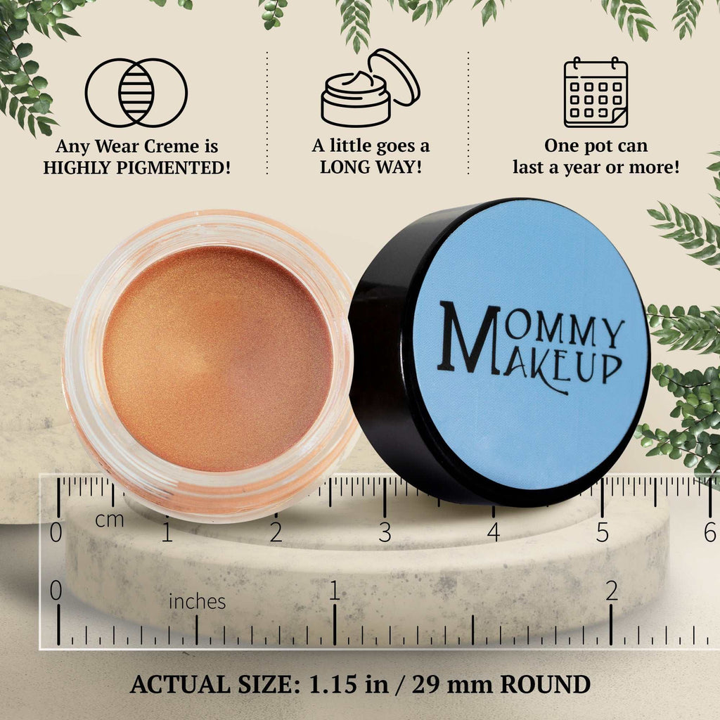 Golden Apricot Any Wear Creme in a small round clear jar with black lid, showing creamy peachy apricot shade for eyes, cheeks, and lips