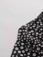 Halter Neck Polka Dot black fabric with white polka dots, slightly stretchy polyester, tied feature visible