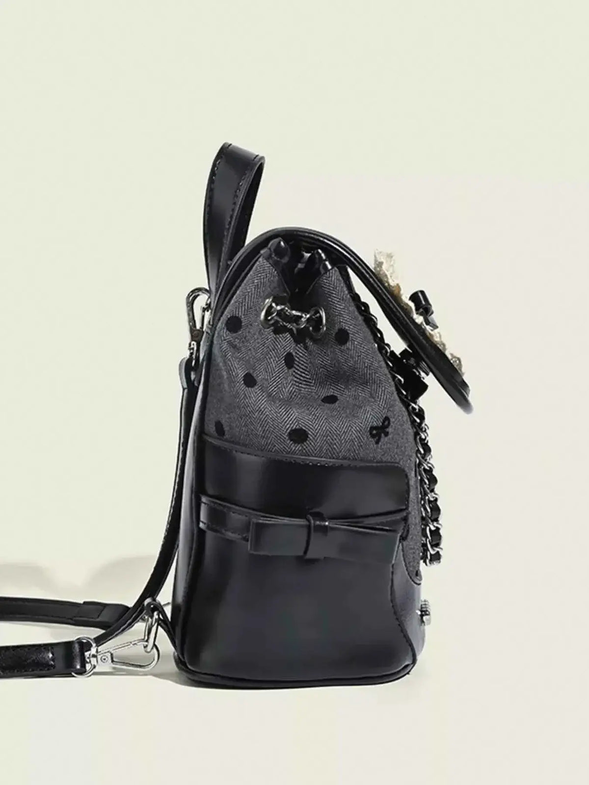 Mini black and grey PU leather backpack bag with polka dot pattern, bow detail, and Heart Decor Chain accent