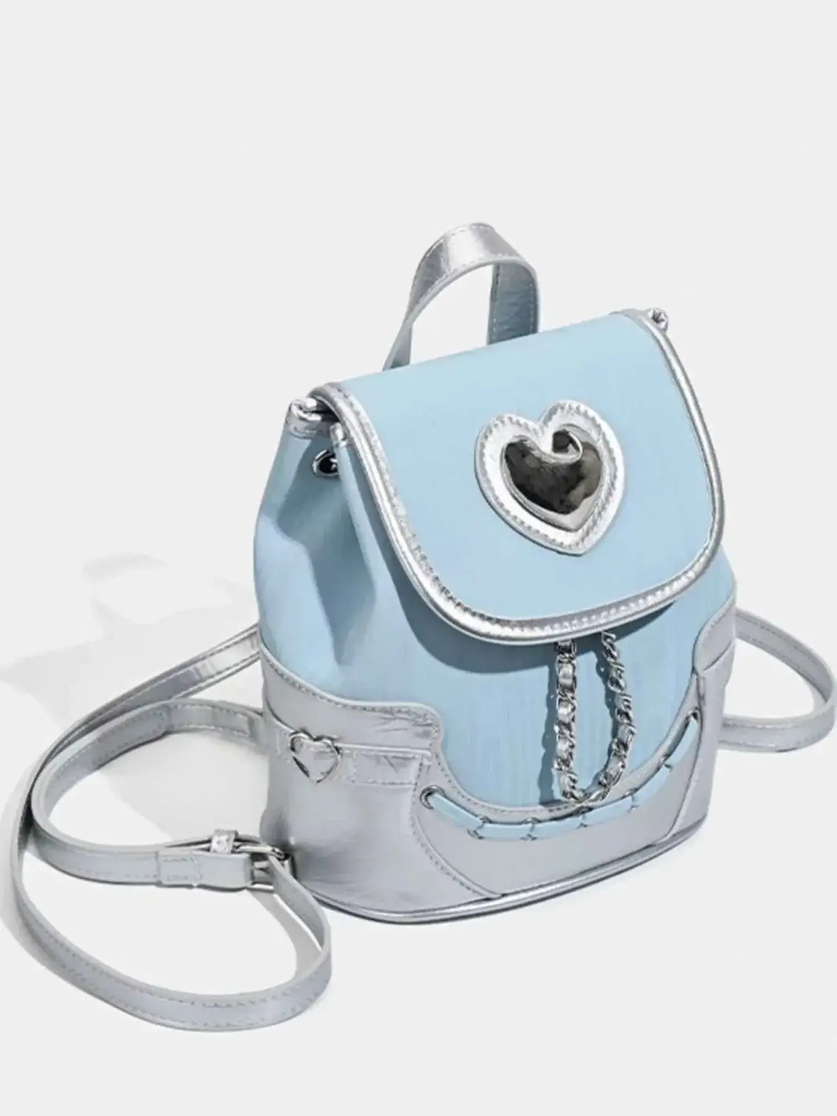 Mini Heart Flap Backpack in light blue PU leather with metallic silver trim, front heart detail, and chain embellishment.