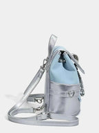 Mini Heart Flap Backpack in metallic silver PU leather with a heart-shaped metal charm and adjustable straps