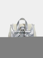 Mini Heart Flap Backpack in metallic silver PU leather with a small top handle and adjustable straps visible from the back