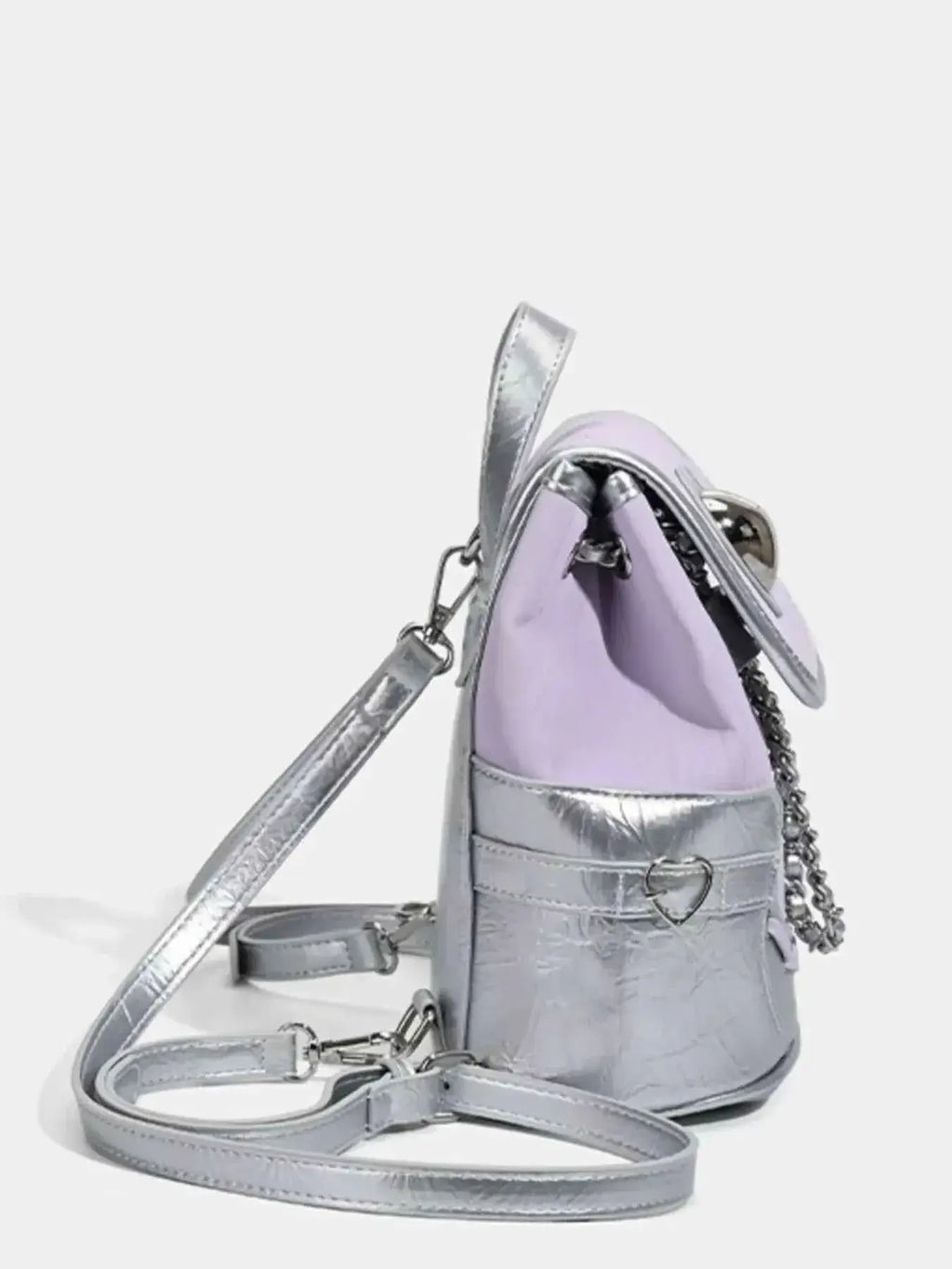 Heart Flap Backpack in mini size featuring metallic silver PU leather with a lavender heart-shaped flap and chain detail