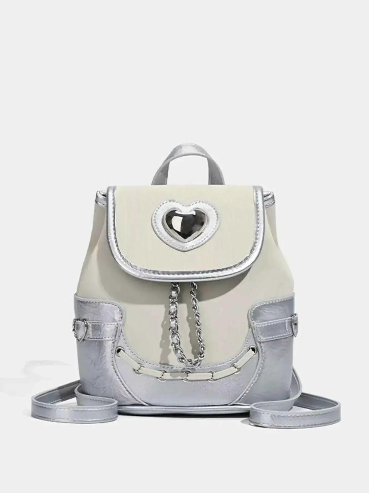Heart Flap Backpack in silver and cream PU leather with a heart-shaped cutout on the flap and chain detail on the front.