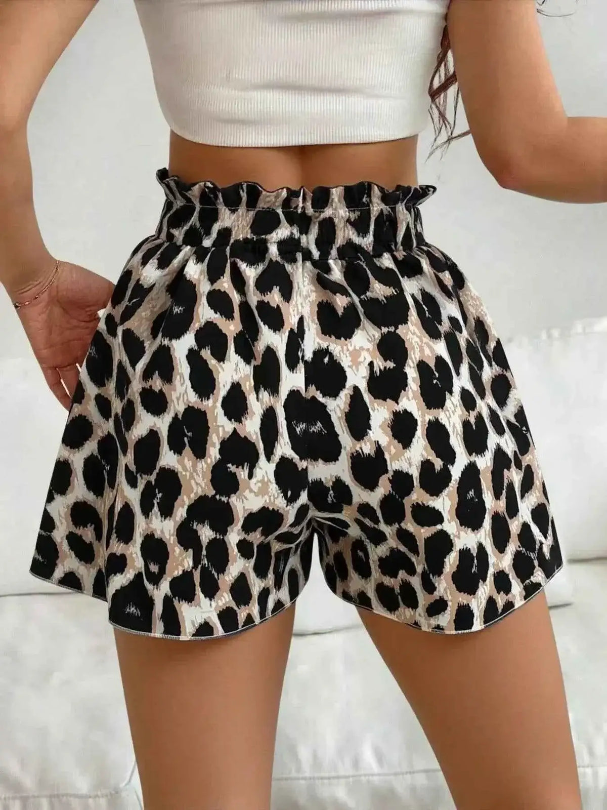 High-Waisted Leopard Print Shorts in beige black with paperbag waist and drawstring detail made of polyester fabric