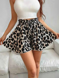 High-Waisted Leopard Print Shorts with black and beige pattern, paperbag waist, and drawstring tie, worn with a white crop top