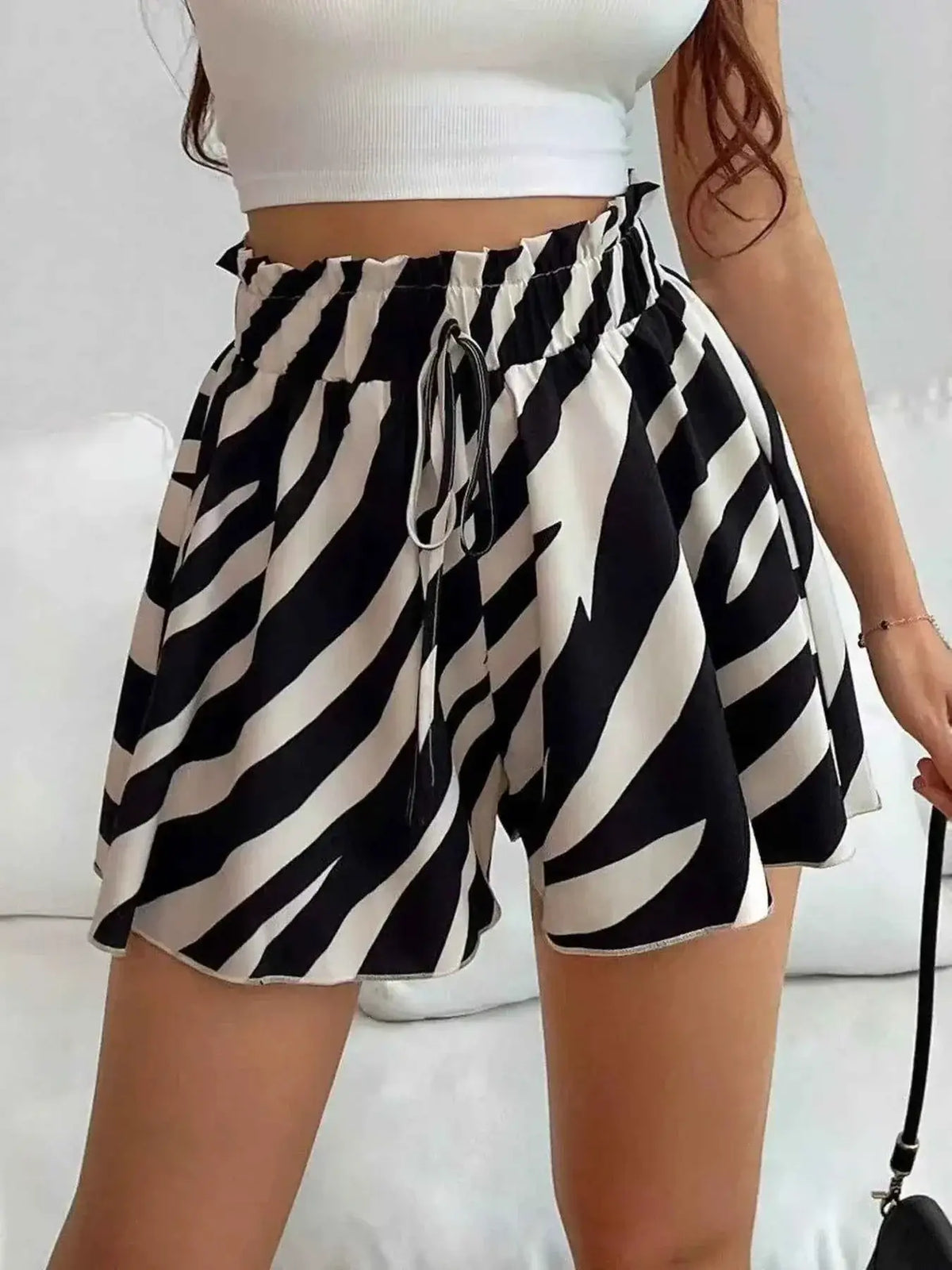 High-Waisted Leopard Print Shorts made of polyester with a black and white zebra pattern and a drawstring paperbag waist