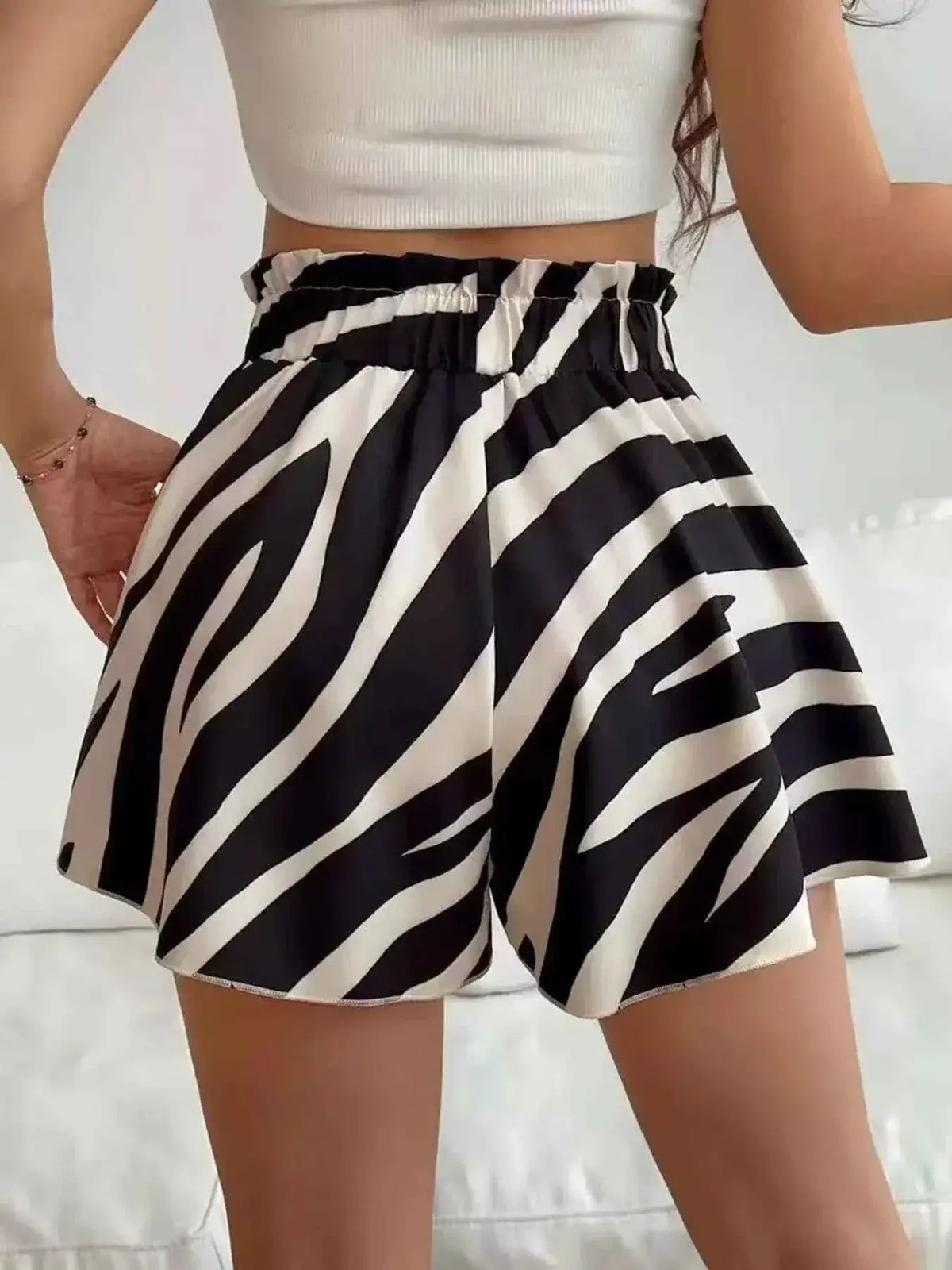 High-Waisted Leopard Print Shorts styled with a black and white zebra stripe pattern, featuring a paperbag waist and drawstring tie
