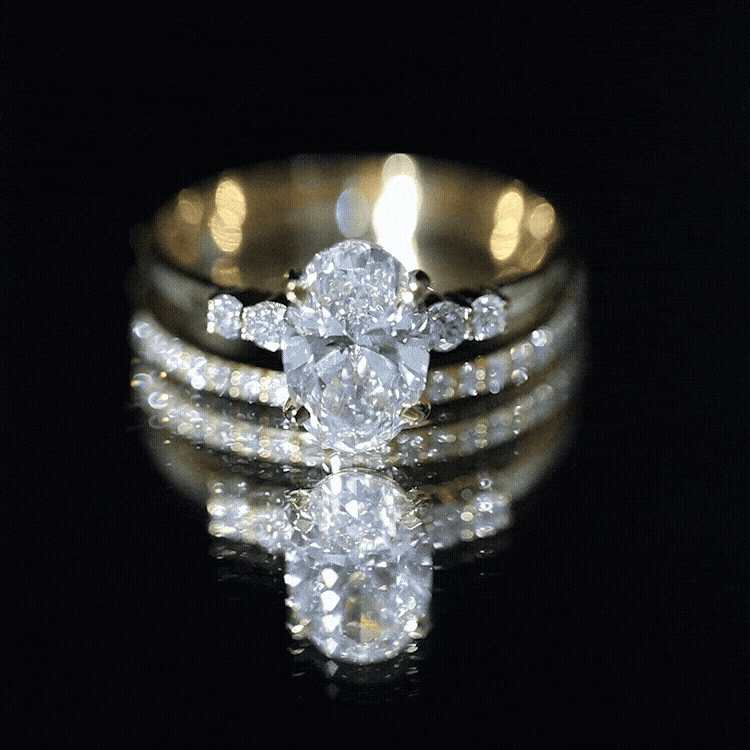 IGI Certified Diamond 3 carat oval lab grown diamond ring set in yellow gold with round side stones and half eternity band