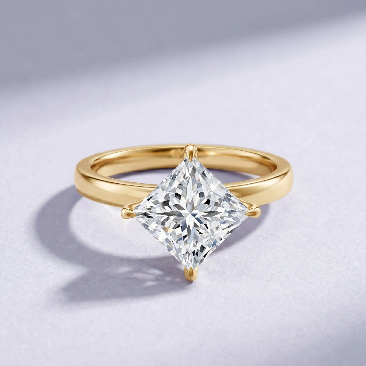 Gold band engagement ring featuring a large 4 carat princess cut IGI Certified Diamond set in a claw setting, clear and brilliant