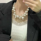 Imitation Pearl Women's Necklace with large round white beads worn with black blazer and white lace top