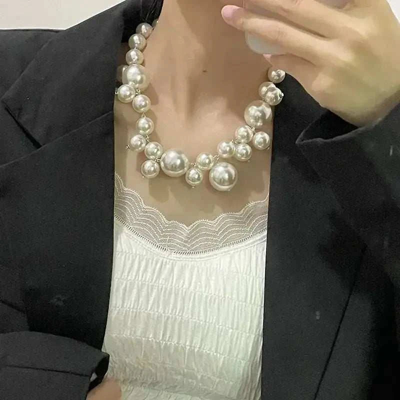 Imitation Pearl Women's Necklace with large round white beads worn with black blazer and white lace top