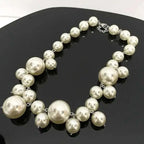 Imitation Pearl Women's Necklace featuring large and small round ivory-colored beads with silver-tone metal links and clasp