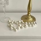 Imitation Pearl Women's Necklace featuring large and small white round beads in a double strand choker design with silver clasp
