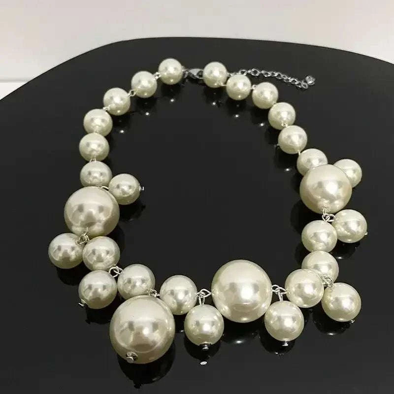 Imitation Pearl Women's Necklace featuring large and small shiny white simulated pearls in a chic choker style with silver links