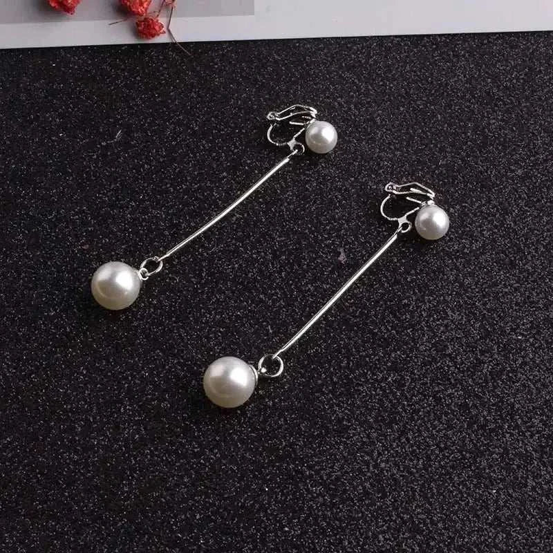 JIOFREE Fashion long clip on earrings featuring elegant white simulated pearls and silver metal rods without pierced holes
