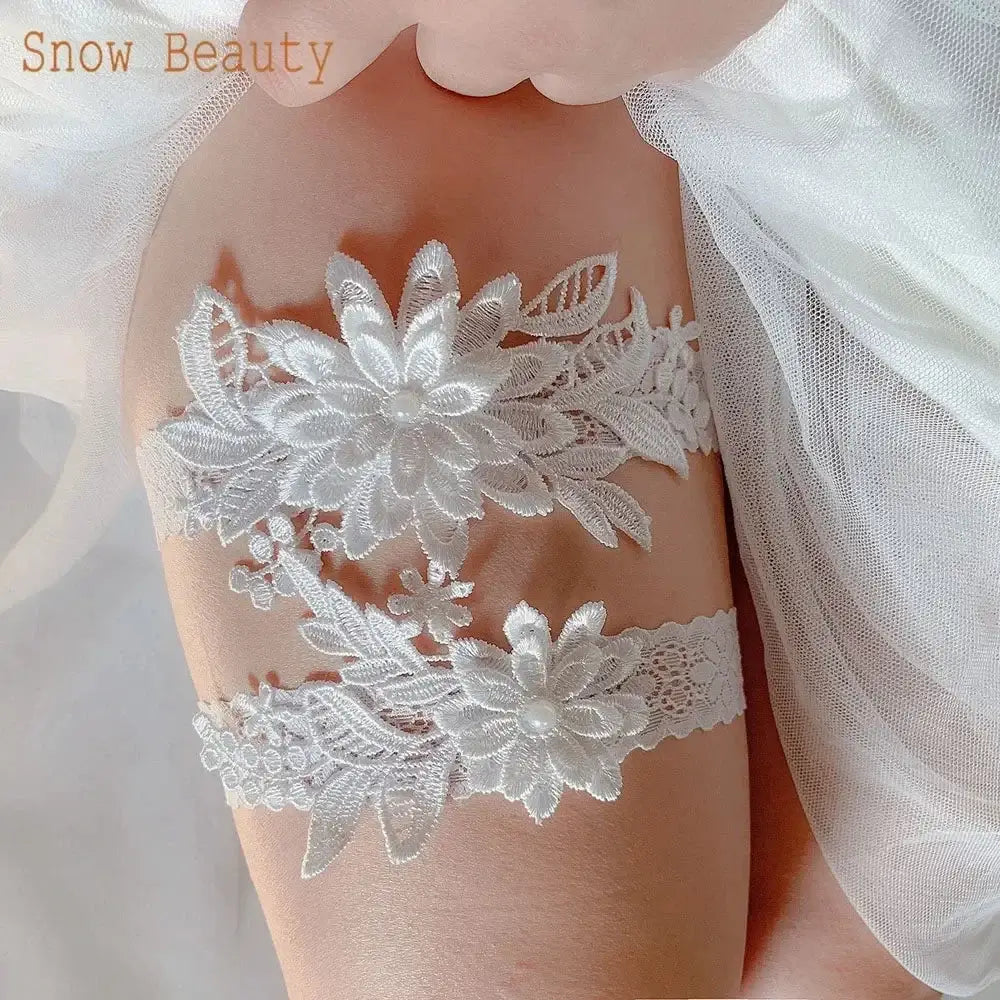 Sexy Lace Flower white lace garter set with flower and leaf appliques on thigh, featuring intricate floral design