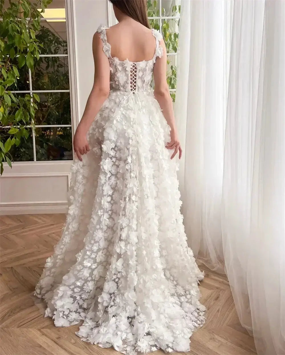 Kyoto Beige Wedding Dress with back lace-up detail, sleeveless straps, and 3D floral appliques on flowing train