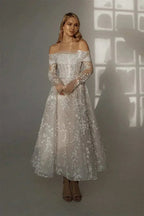 Kyoto Customized Lace off-shoulder wedding dress with floral lace pattern, long sleeves, and ankle-length skirt