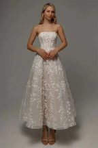 Kyoto Customized Lace strapless white wedding dress with floral lace appliques and an ankle-length A-line silhouette