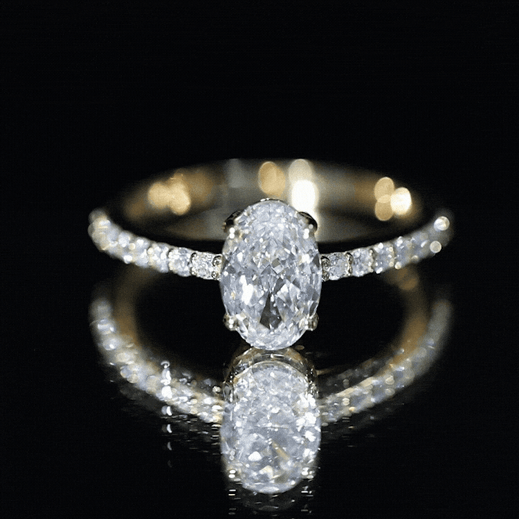 Lab Grown Diamond 2 carat oval cut engagement ring in prong setting with diamond accented gold band
