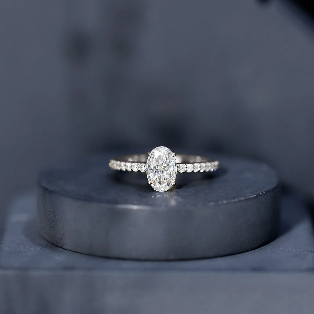 Lab Grown Diamond 2 carat oval cut engagement ring in prong setting with round diamond accents on silver band