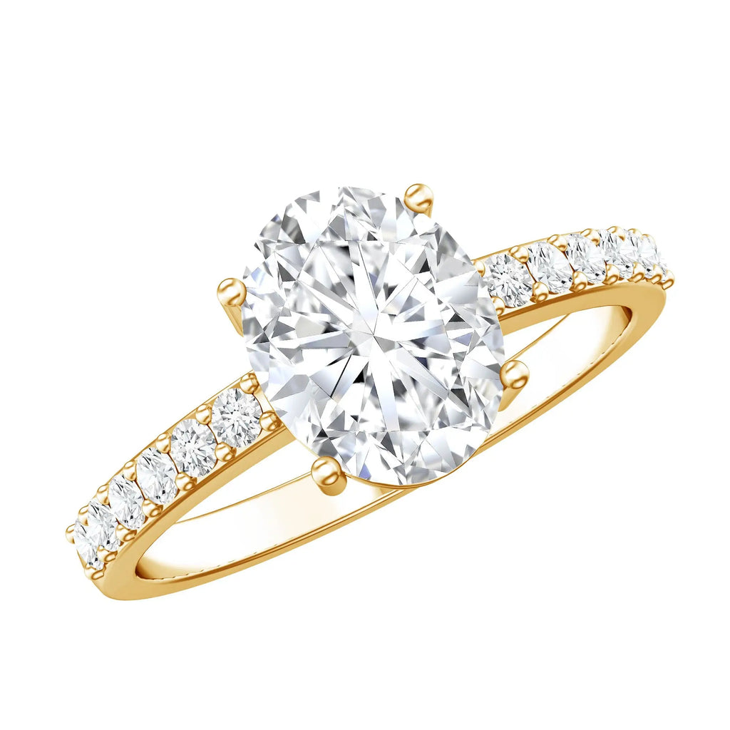 Lab Grown Diamond 2 carat oval cut engagement ring in yellow gold with brilliant prong setting and accent diamonds on band
