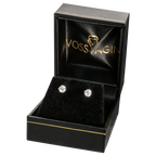 lab-grown diamond earrings with round brilliant cut clear stones set in solid 14K gold four-prong settings in a black gift box