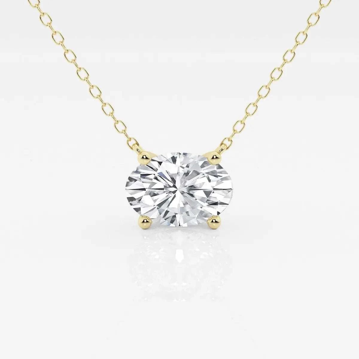 Lab Grown Diamond oval solitaire pendant with a sparkling clear stone set in four-prong 14K yellow gold chain