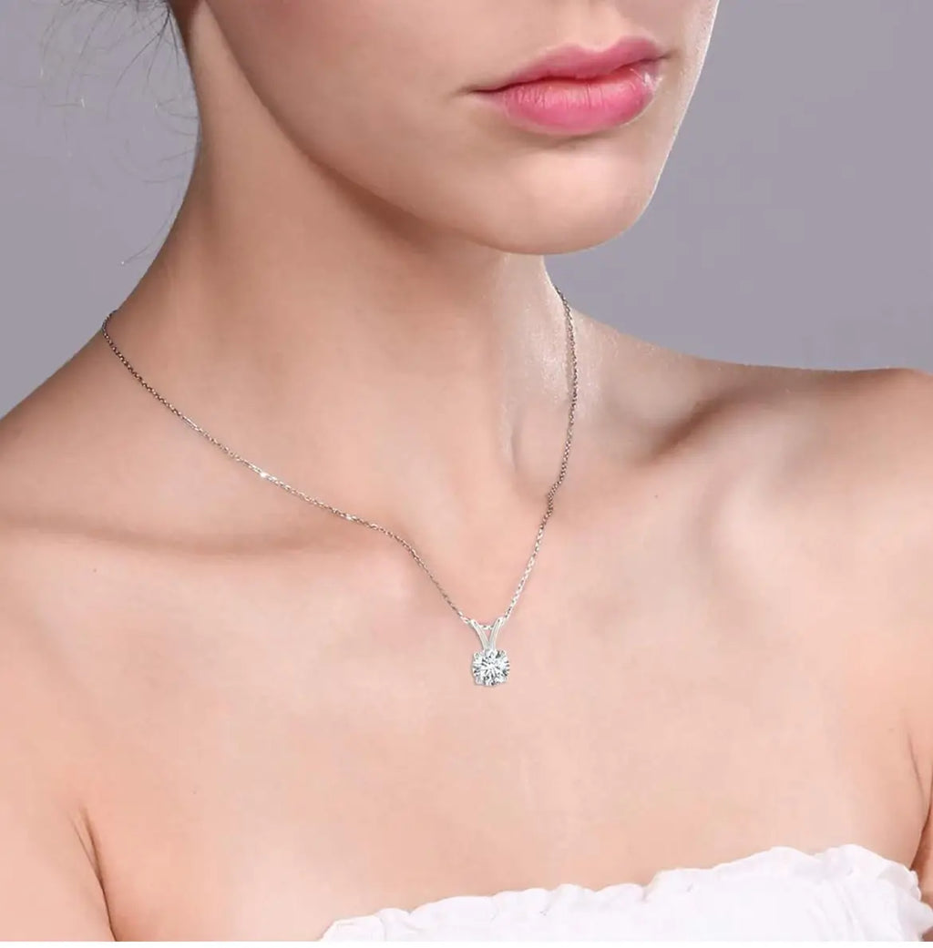 Lab grown diamond pendant featuring a round-cut, sparkling clear diamond set in 14K white gold on a delicate chain