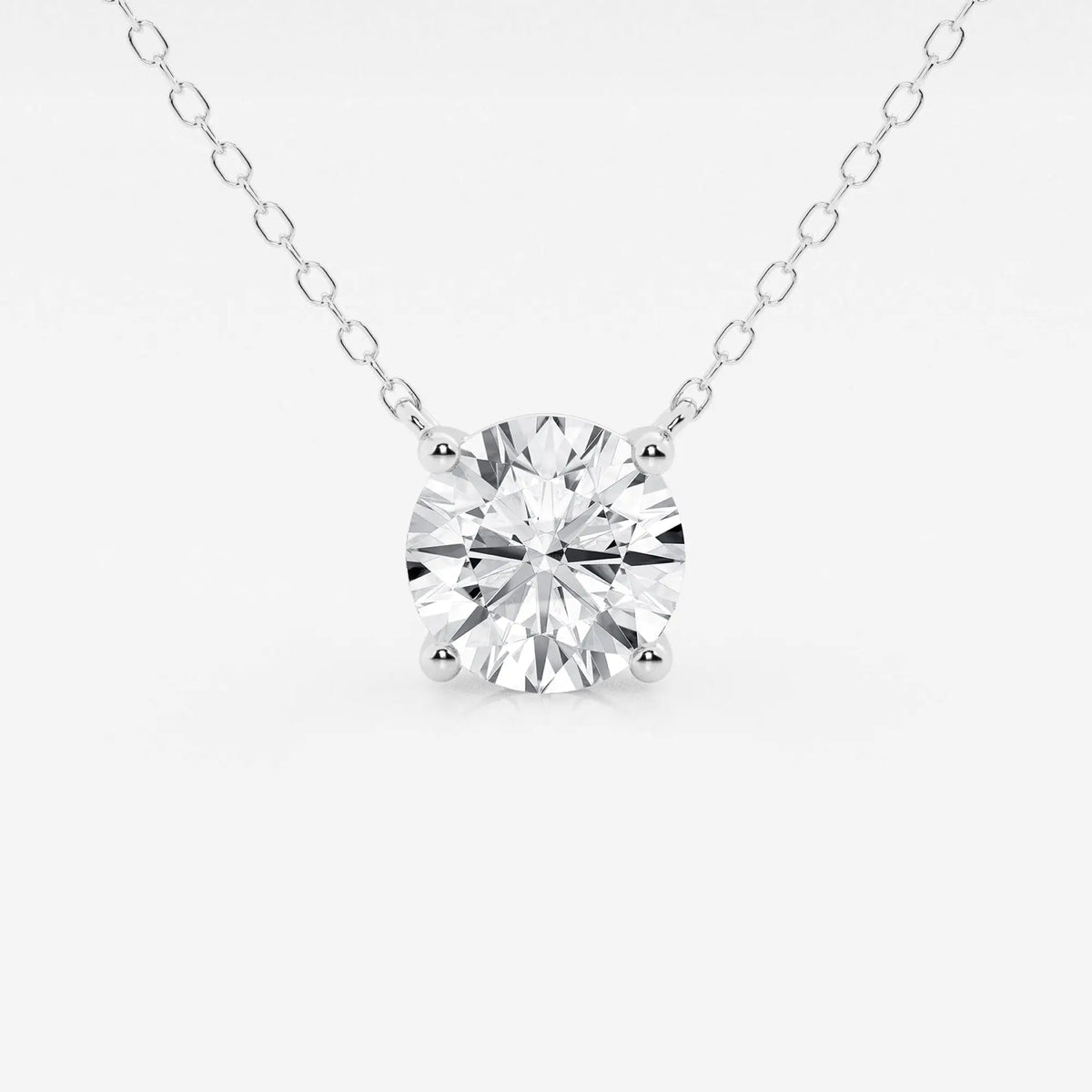 Lab Grown Diamond solitaire pendant with a round brilliant cut diamond set in a white gold four-prong setting on a delicate cable chain