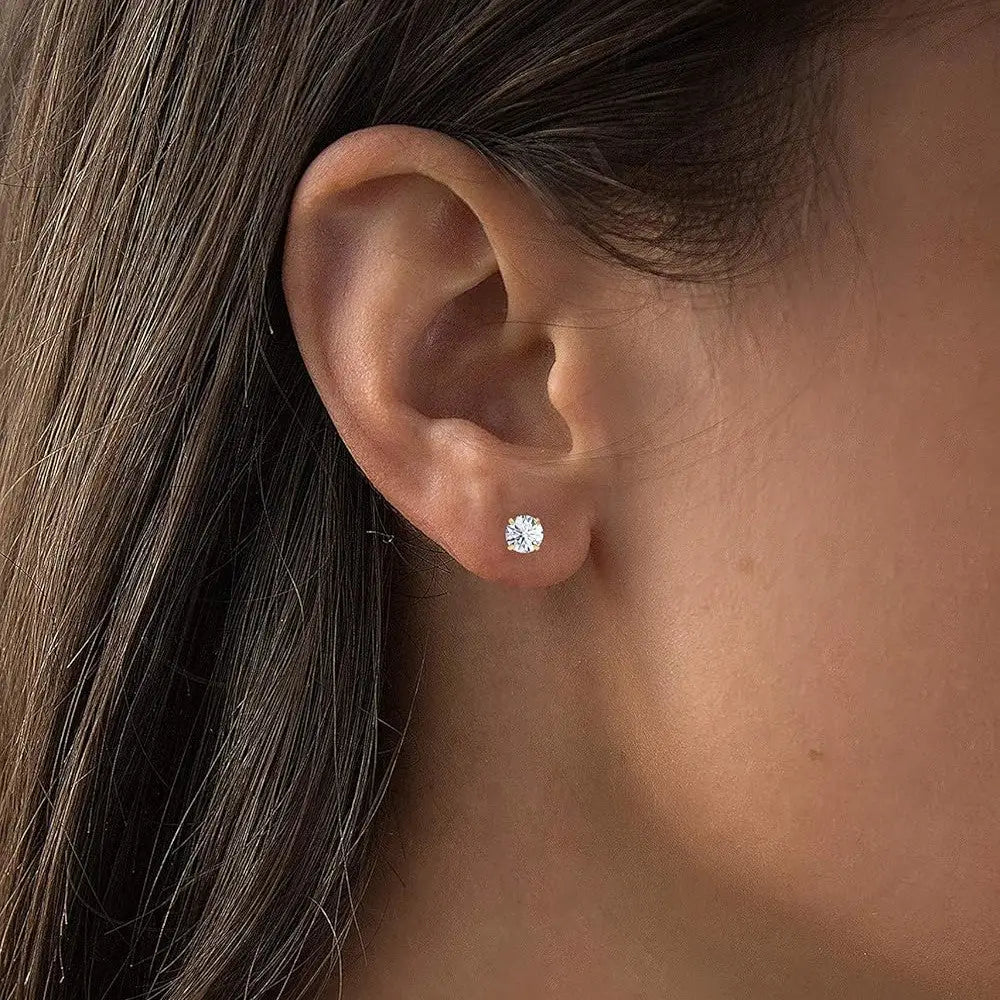 Round lab-grown diamond stud earring in four-prong 14K white gold setting on ear, sparkling bright