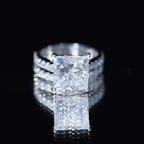 Lab Grown Diamond solitaire wedding ring set with a 5 carat princess cut center stone and round side stones in prong setting