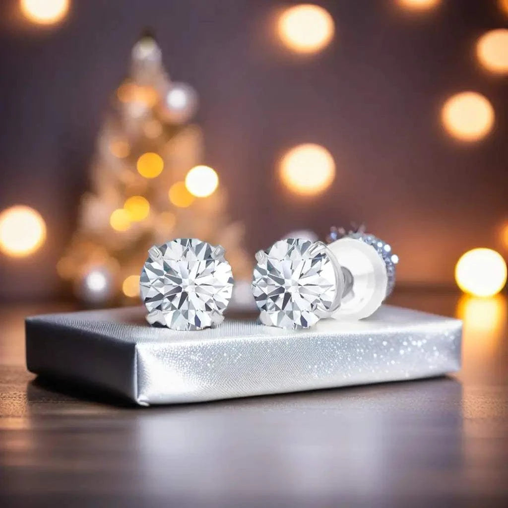 Lab-grown diamond stud earrings in 14K white gold with round brilliant cut, sparkling clear stones set in four-prong style
