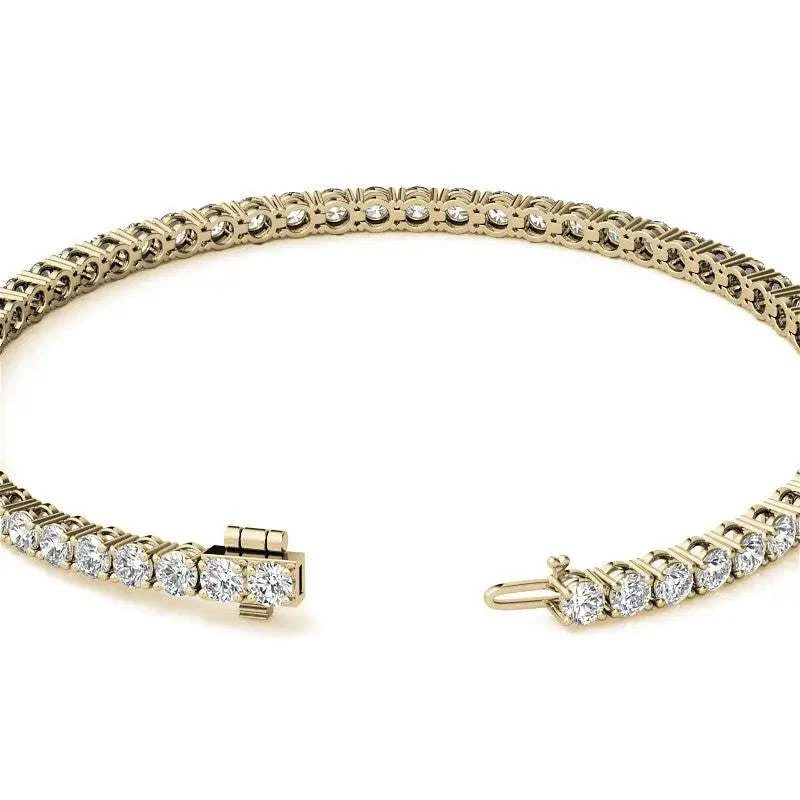 Lab-grown diamond tennis bracelet in 14K yellow gold featuring round brilliant G/VS clarity diamonds in a 4-prong setting