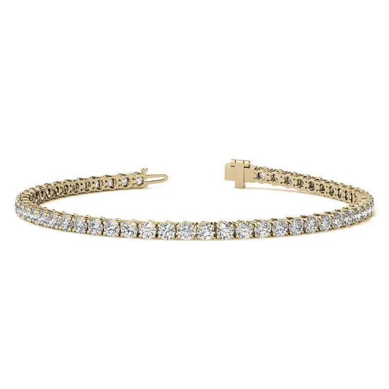 Lab Grown Diamond tennis bracelet featuring round brilliant stones set in 14kt yellow gold with secure box clasp