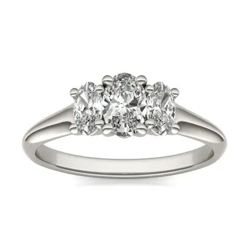Three stone engagement ring with a lab grown diamond oval cut trio set in 14K white gold band