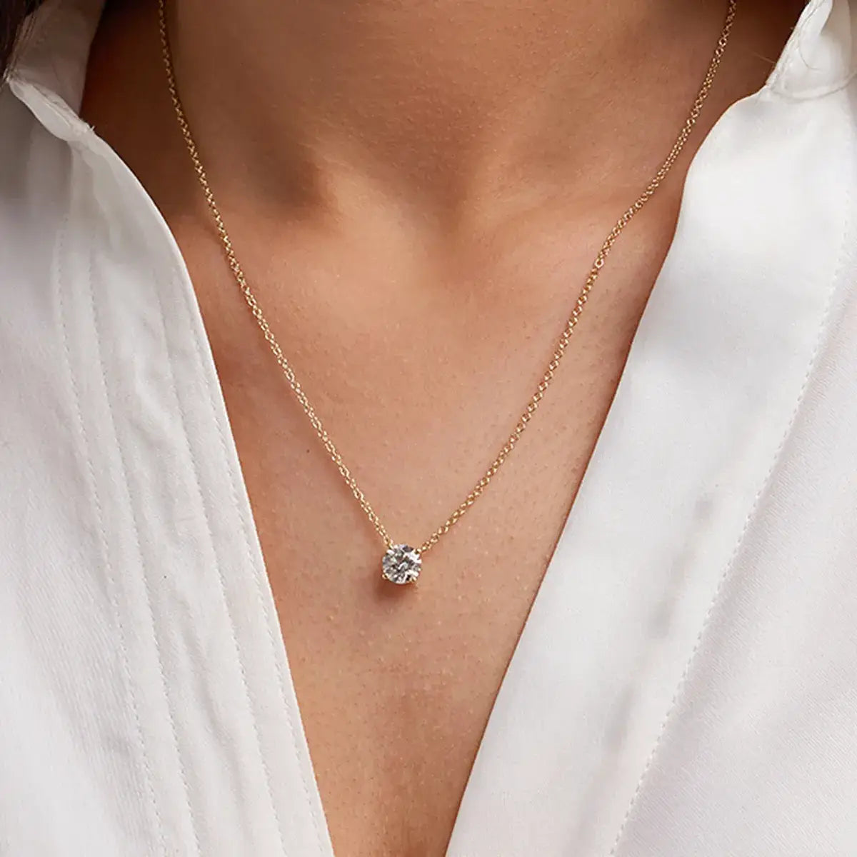 Lab Grown Round Diamond solitaire pendant with round brilliant diamond in 14K yellow gold prong setting on delicate chain