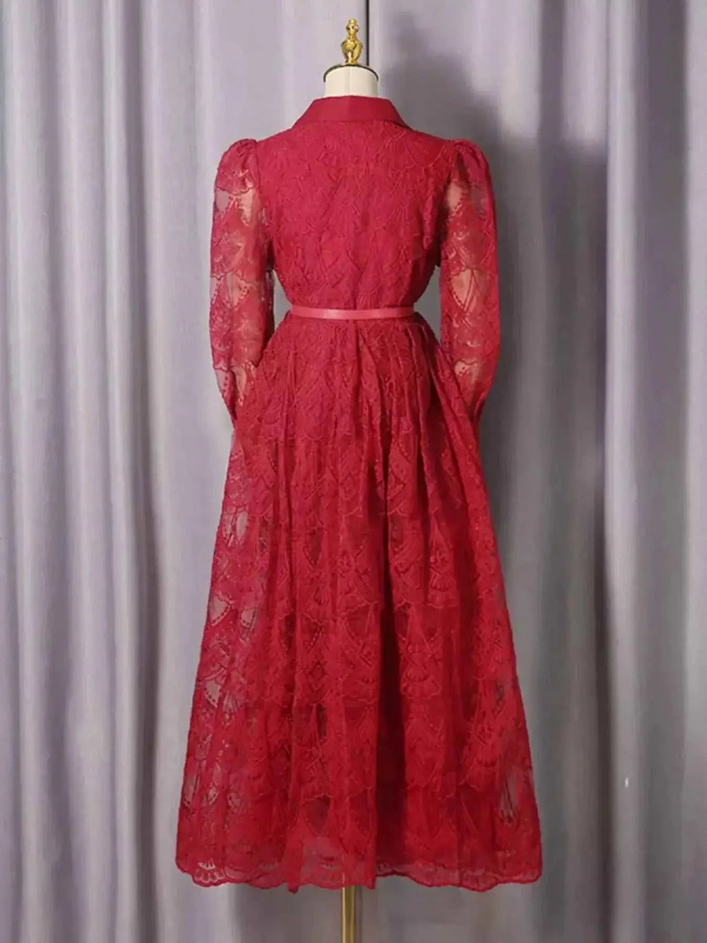 Lace Button Front Midi Dress in red featuring sheer long sleeves, floral lace fabric, and a fitted waist with belt detail