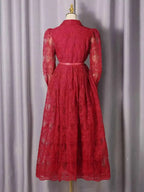 Lace Button Front Midi Dress in red featuring sheer long sleeves, floral lace fabric, and a fitted waist with belt detail