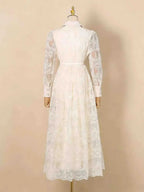 White Lace Button Front Midi Dress featuring long sheer lace sleeves and a fitted waist with buttoned cuffs