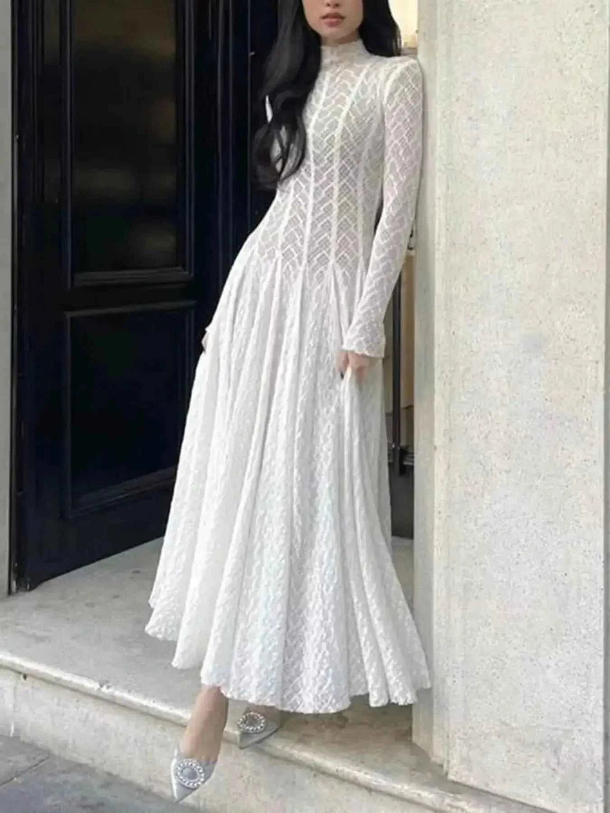 Lace Mock Neck long sleeve white maxi dress with intricate lace pattern and fitted waist, elegant and flowing skirt