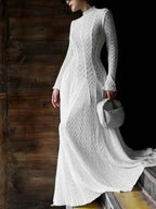 Lace Mock Neck long sleeve white maxi dress with textured lace pattern and fitted silhouette, paired with a small white woven handbag