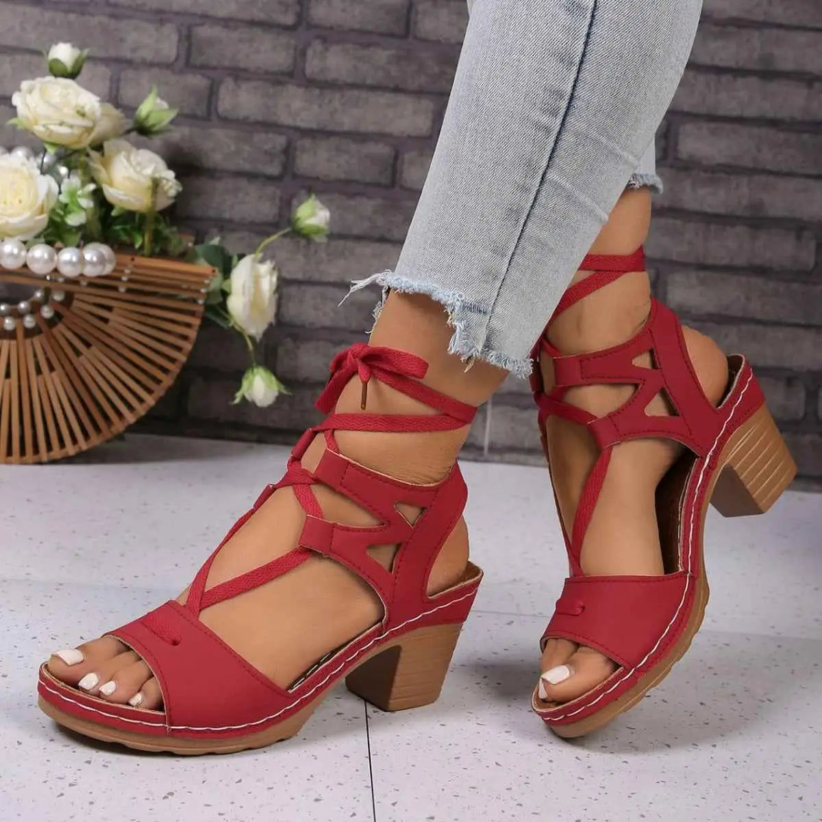 Lace-Up Block Heel Sandals in red PU leather with ankle straps and mid-height wooden block heels, worn with frayed hem jeans.