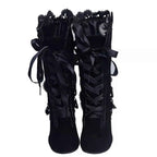 Lace Up Block Heels Boots in black suede with satin ribbon laces and scalloped lace trim detailing at the top.