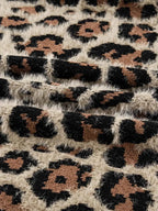 Leopard Open Casual Cardigan fabric close-up featuring fuzzy textured knit in beige with black and brown leopard spots