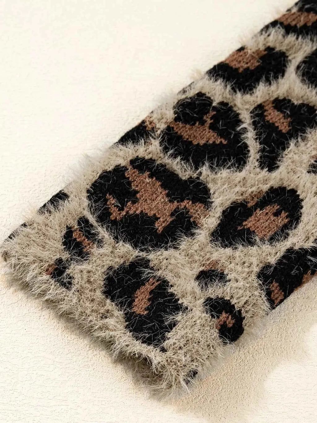 Leopard Open Casual Cardigan sleeve in fuzzy beige fabric with black and brown leopard spots pattern and a pocket detail