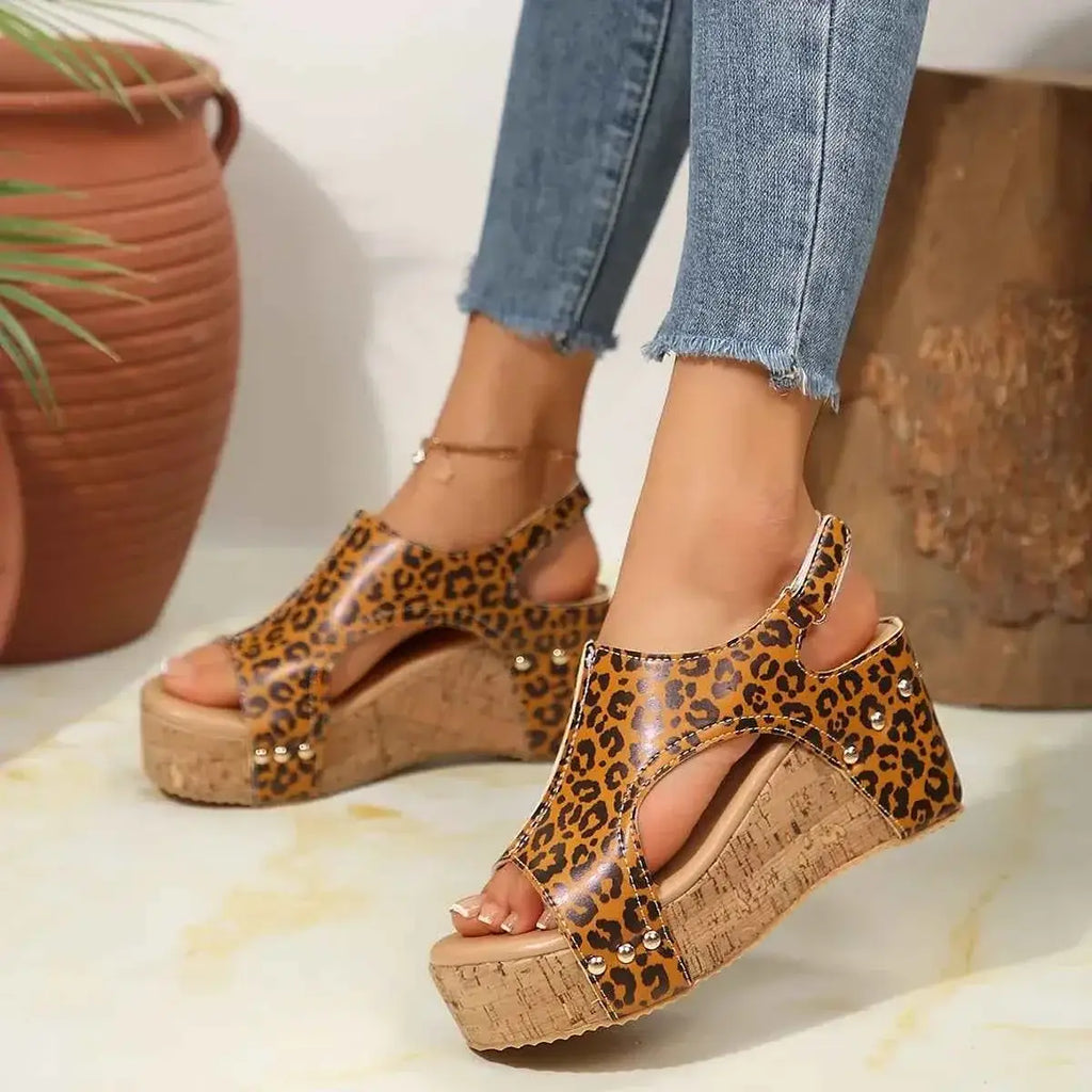 Leopard Peep Toe wedge sandals with cork platform and leopard print PU leather upper, worn with blue jeans