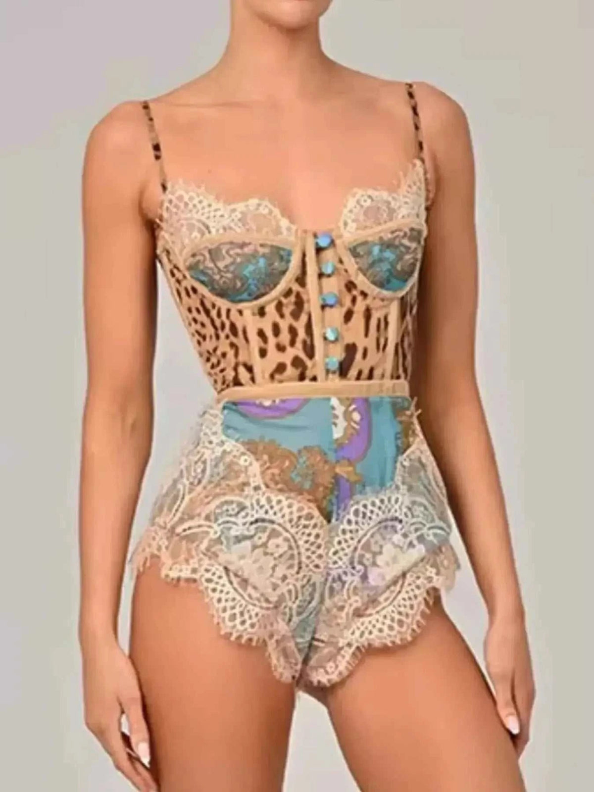 Leopard Print Lace trim romper in beige with blue buttons, lace detailing, and mixed animal and floral patterns